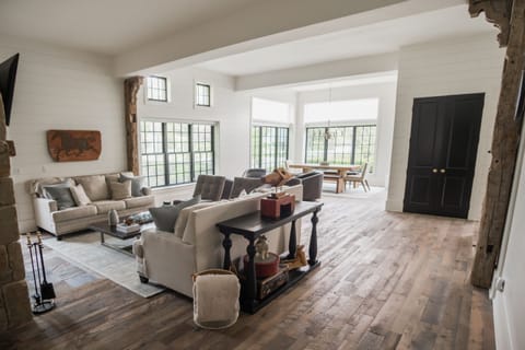 The Black Door Bungalow is filled with gorgeous, reclaimed wood flooring and antique beams.