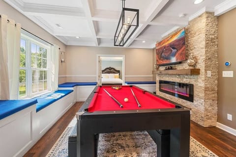 Fully equipped  Game room  with Pool table, Ping Pong, Wireless hook ups for Gaming, 60 inch TV, lineal fireplace and more...