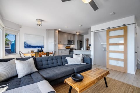 Main level open concept living space with panoramic lake views