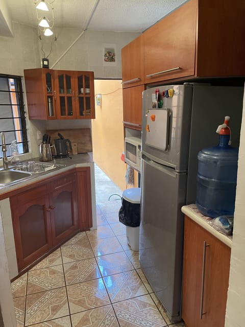 Fridge, microwave, electric kettle, cookware/dishes/utensils