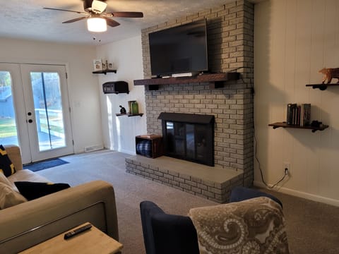 A fireplace and large TV to keep you warm and entertained