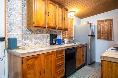 Pots, pans, cutlery, serving ware, glasses, and a full complement of appliances make the kitchen a cook's delight.