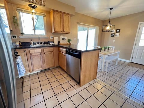 Kitchen is fully stocked includes dishwasher and has roomy dining area
