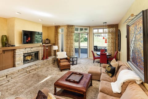 The living room is a cozy and welcoming space to relax after a day of exploring the Aspen Snowmass area.