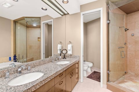A luxurious 5 piece bath with steam shower is attached to the upstairs king bedroom.