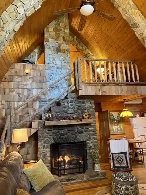Unique blend of stonework and log cabin interior design!