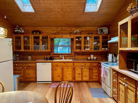 Large, open kitchen with two sunlight windows in the ceiling. 