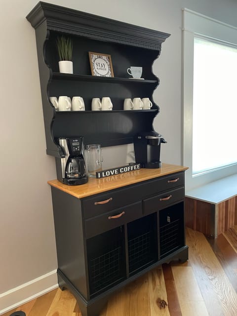 Coffee station with a traditional 12-cup coffee maker and a Kuerig single serve.
