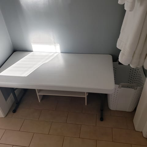 Luggage table with storage below. 