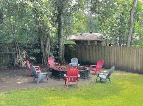Large fitepit in a massive back yard with grill
