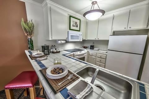 Fridge, microwave, coffee/tea maker, dining tables