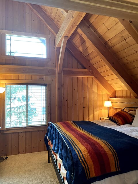 Master bedroom with king bed and view of Summit East 