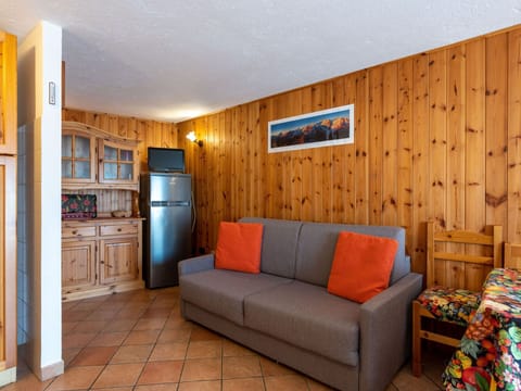 Furniture, Couch, Cabinetry, Wood, Interior Design, Living Room, Flooring, Lighting, Yellow, Comfort