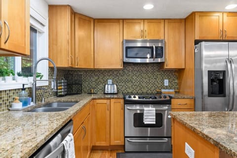 The kitchen boasts plenty of counter space and is fully stocked.