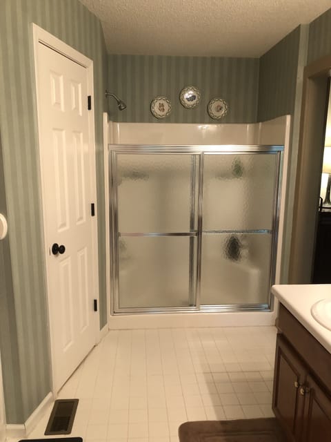 Combined shower/tub, hair dryer, towels, soap