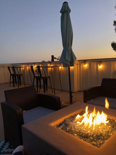 rooftop deck fire pit and sunset