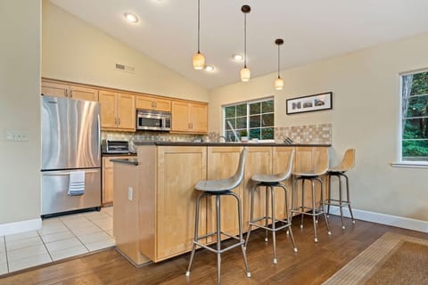 Plenty of seating so you and your guests can enjoy cooking with company. Board games, and outdoor-appropriate drinkware can be found in the cupboards near the bar stools.