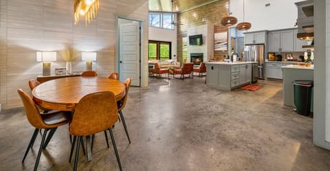 Dine in style with the open-concept layout that brings the family together, surrounded by natural elements