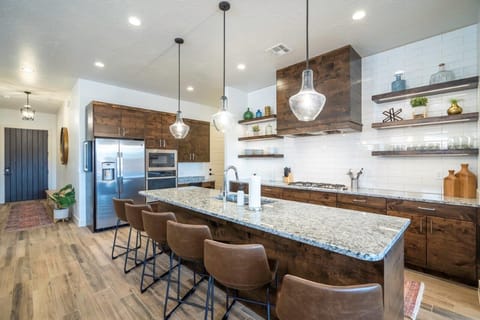 Large kitchen with island bar seating for 6 people