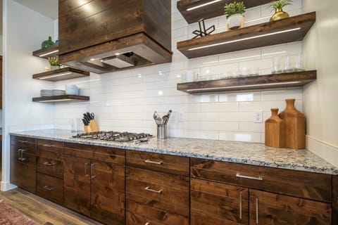 Kitchen is stocked with appliances and utensils for cooking