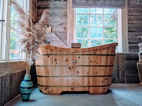 Relax in the Japanese Soaking tub made of Cedar. It can fit you and a loved one.