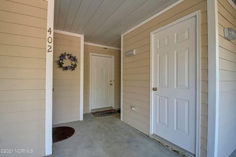 Front Door on right with combo lock
