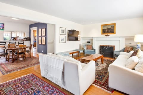 Living room with plenty of space to sit and large TV with cable