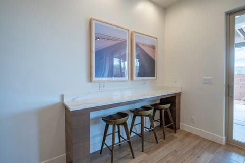 Additional bar seating for 3 (located behind the dining room table)