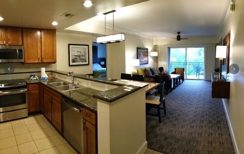 Villa  kitchen, living room, dining room & balcony.  BRs &bths on both sides. 