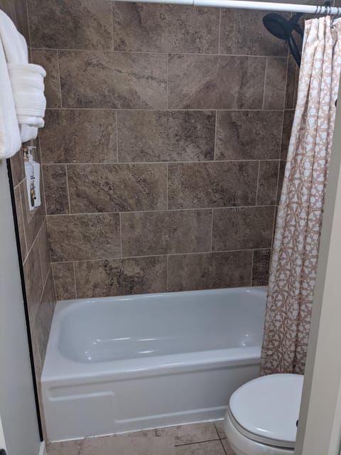 Combined shower/tub, hair dryer, towels, soap