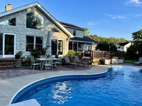 Sunroom looking over backyard pool