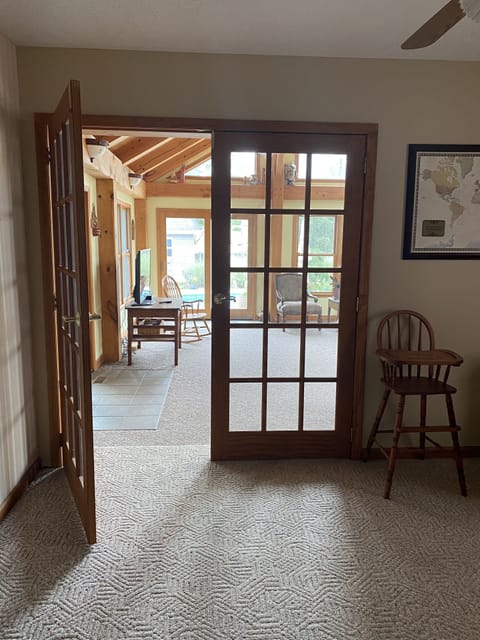 French doors leading from family room to the sunroom