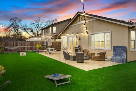 Your pets, kids, friends and family will fall in love with this back yard! Fully fenced, fake turf, market lights, BBQ and Gas fire pit