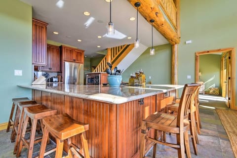  Kitchen includes 5 burner gas stove top with retractable vent, a wine fridge, french door fridge, dishwasher, oven and microwave