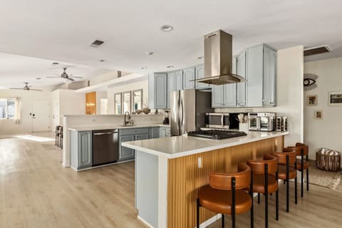 A sunlit space ready for morning rituals and midnight snacks.