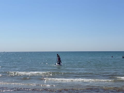 On the beach, sun loungers