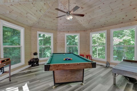 4.5' x 8' Pool table and dart board in games room.