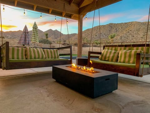 Our swinging dual porch swings creates a fun outdoor living space day or night.