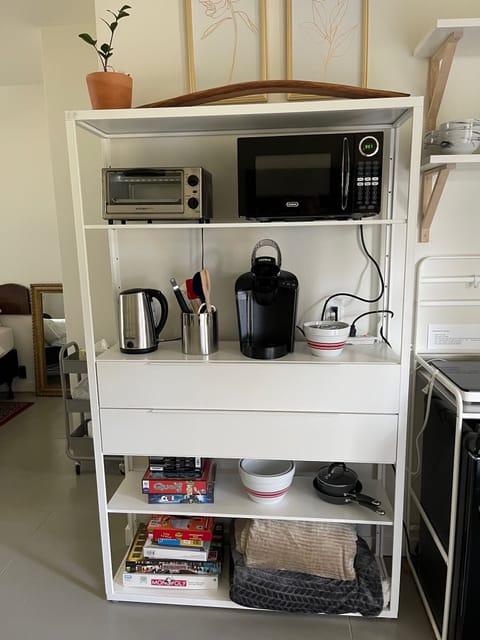 Kitchenette with Keurig coffee, tea kettle, microwave, toaster oven