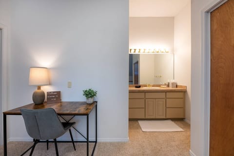Sitting area in upstairs bedroom with private vanity.