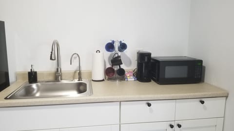 Fridge, microwave, stovetop, coffee/tea maker