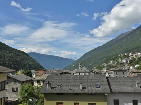 Cloud, Sky, Mountain, Building, Window, Plant, House, Tree, Cumulus, Landscape