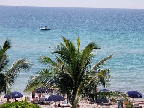 On the beach, sun loungers, beach towels