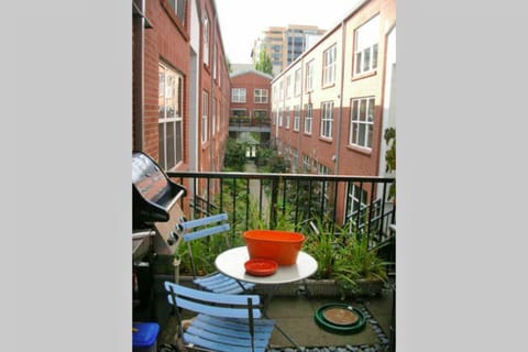 Patio with BBQ and bistro table.