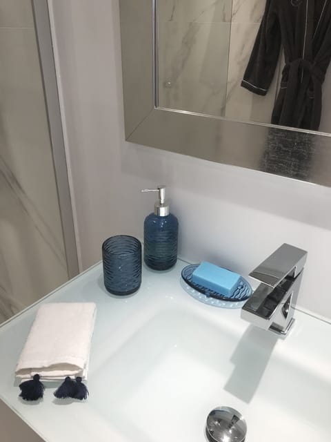 Bathtub, hair dryer, towels, soap