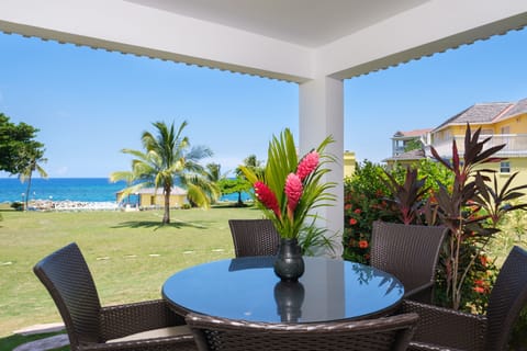 Spacious patio with lounge chair/dining option showcasing a magnificent sea view