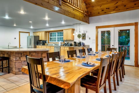 Open floor plan with gigantic dining room table that easily seats 10