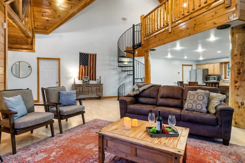 Open living room with lots of seating and exposed beams