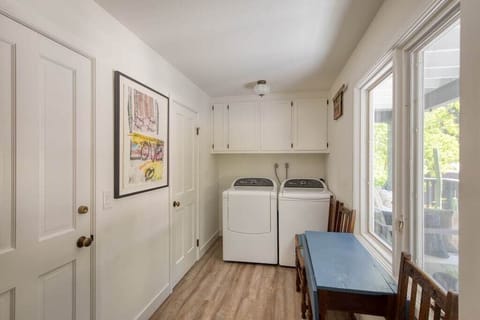 Laundry Room to left of front entry with Half Bath (door next to dryer)