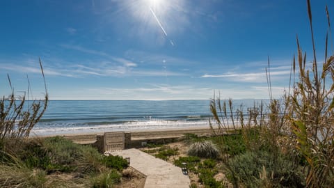 On the beach, sun loungers, beach towels